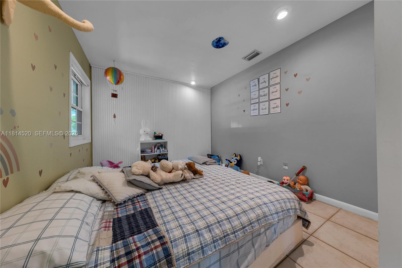 14630 Southwest 147th Court Miami, FL 33196 - Photo 11 of 17 a bedroom with a bed and a lamp on the table