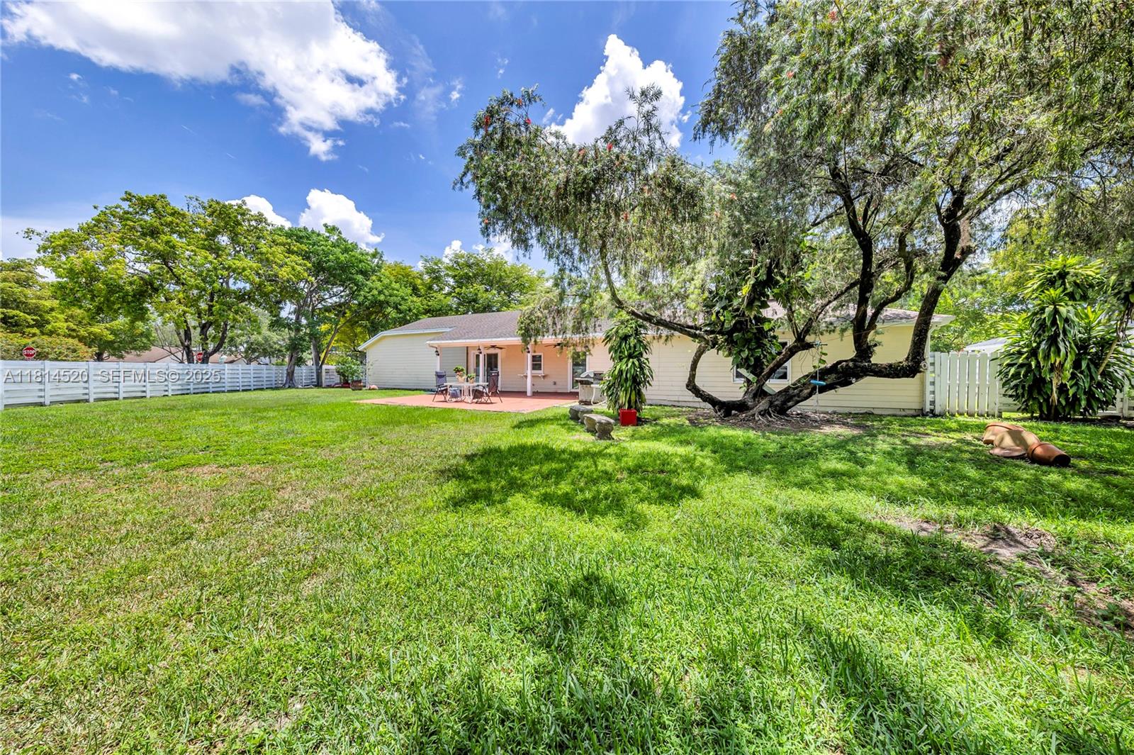 14630 Southwest 147th Court Miami, FL 33196 - Photo 15 of 17 a view of a house with backyard and a sitting area