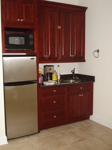 215 East State Road Island Lake, IL 60042 - Photo 7 of 11 a kitchen with a refrigerator and cabinets