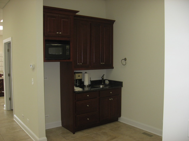 215 East State Road Island Lake, IL 60042 - Photo 9 of 11 a kitchen with a cabinets and a stove top oven