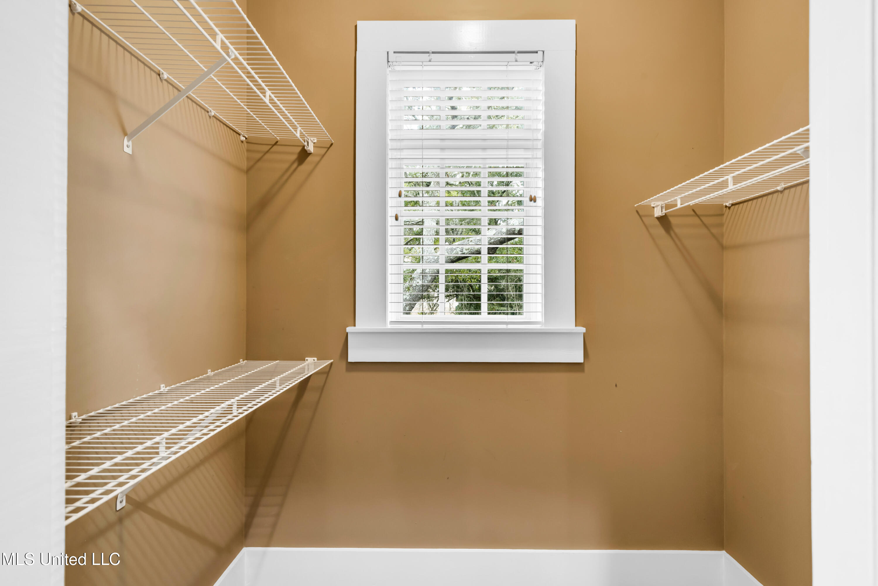 1401 Ladnier Road Gautier, MS 39553 - Photo 33 of 55 His and hers closet in Primary bedroom