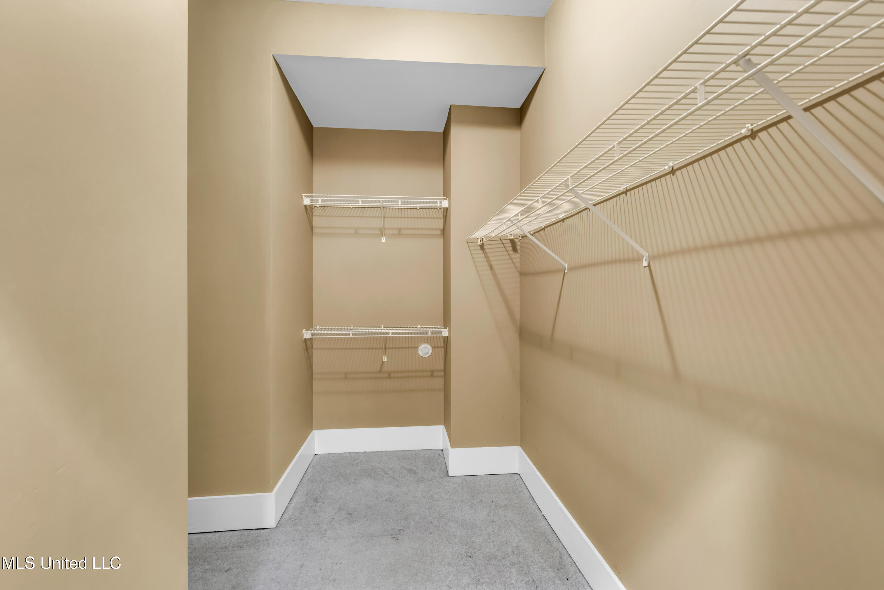 1401 Ladnier Road Gautier, MS 39553 - Photo 34 of 55 His and Hers closet in Primary Bedroom