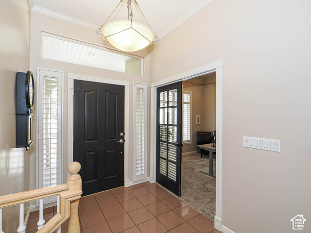 11779 South Stone Ridge Court Ridge West Riverton, UT 84065 - Photo 14 of 85 Entryway featuring a dark paneled door, transom window, sidelights with interior shutters, recessed lighting, and tile flooring