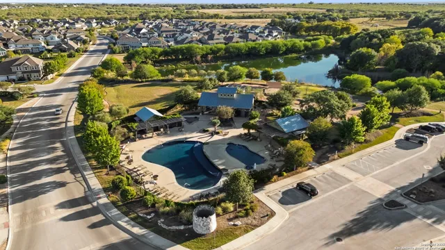 an aerial view of residential houses with outdoor space