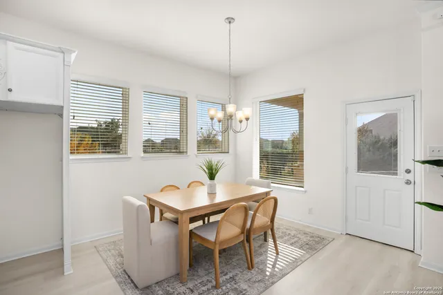 a dining room with furniture and window