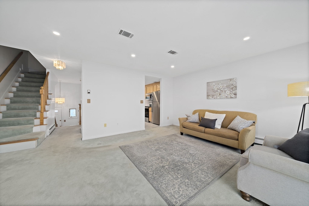 84 Walpole Street, Unit 3L Canton, MA 02021 - Photo 12 of 29 a living room with furniture and painting on the wall