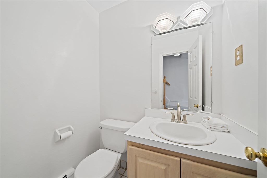 84 Walpole Street, Unit 3L Canton, MA 02021 - Photo 14 of 29 a bathroom with a toilet sink and mirror