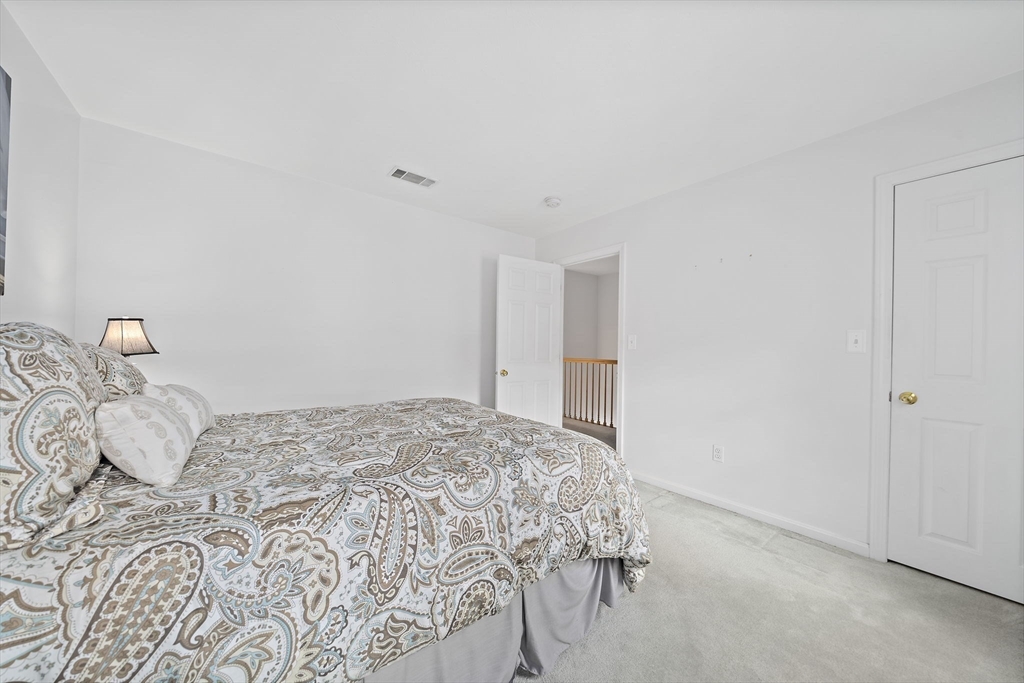 84 Walpole Street, Unit 3L Canton, MA 02021 - Photo 20 of 29 a bedroom with a bed and a window