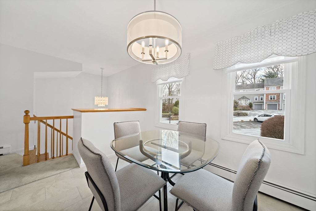 84 Walpole Street, Unit 3L Canton, MA 02021 - Photo 8 of 29 a view of a dining room with furniture and a large window
