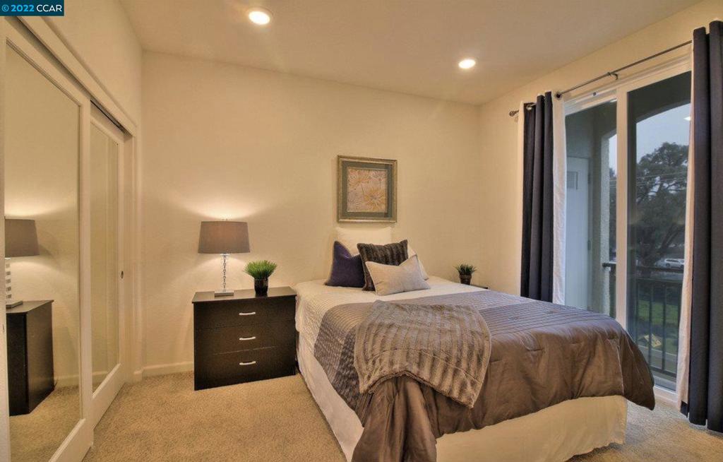 4708 Norris Canyon Road San Ramon, CA 94583 - Photo 4 of 6 a bedroom with a bed and a lamp