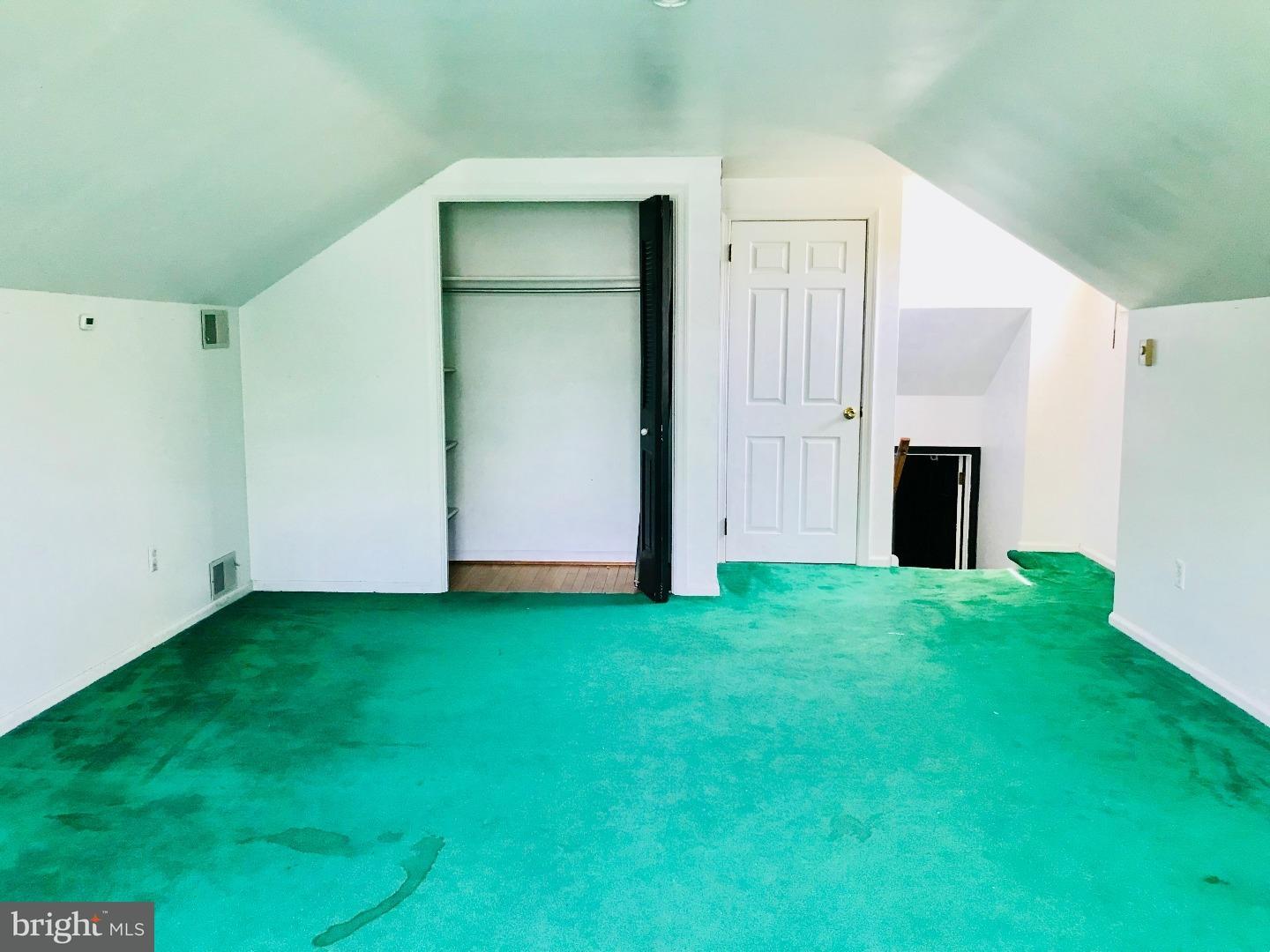 14 Annabeth Road Oley, PA 19547 - Photo 15 of 23 an empty room with closet and a fireplace