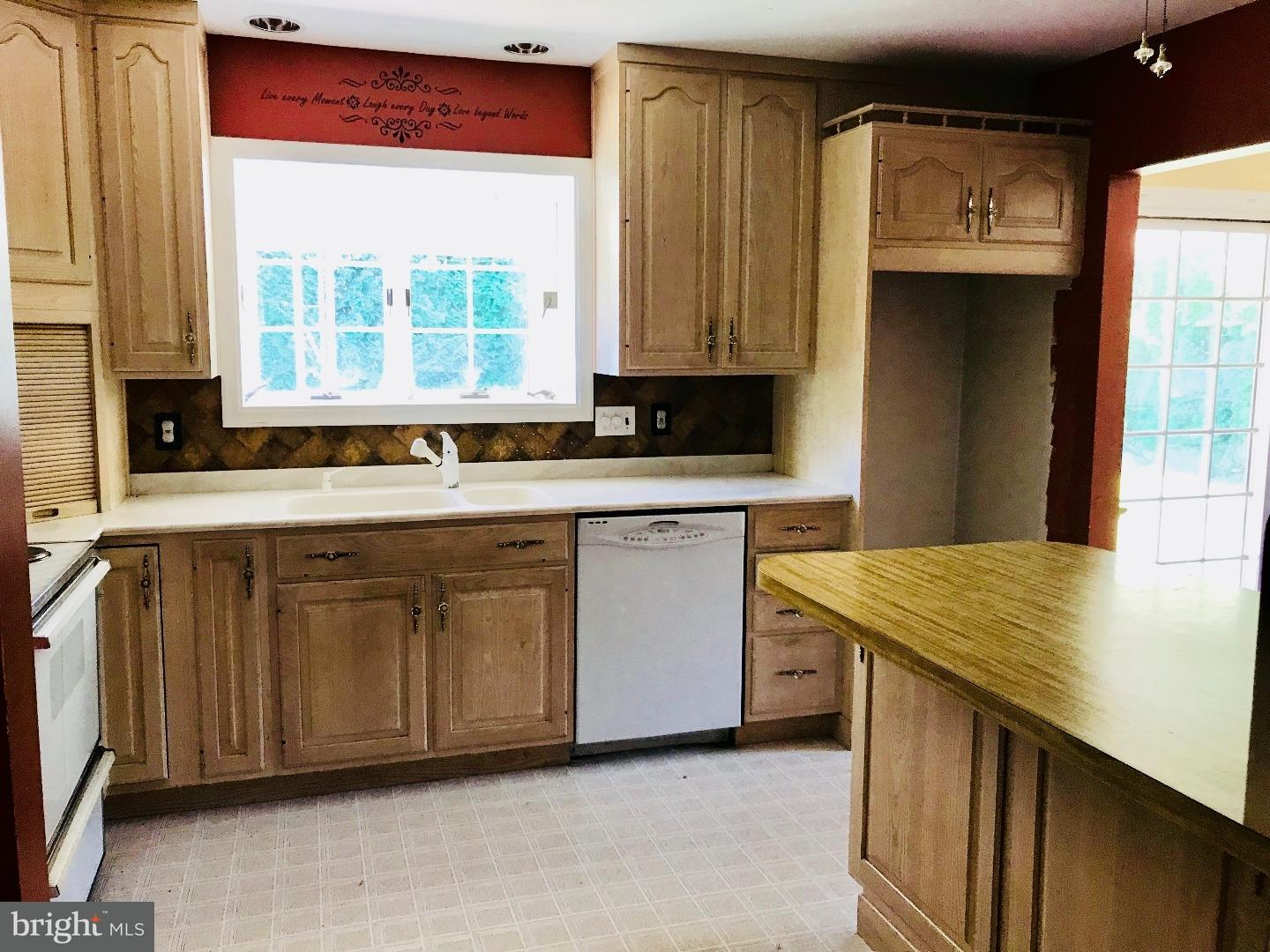 14 Annabeth Road Oley, PA 19547 - Photo 5 of 23 a kitchen with stainless steel appliances granite countertop a sink and a stove