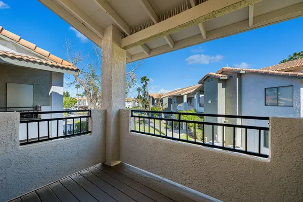 a view of balcony with furniture