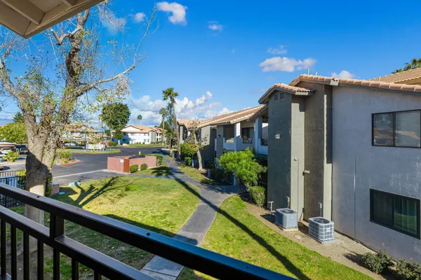 a view of swimming pool from a balcony