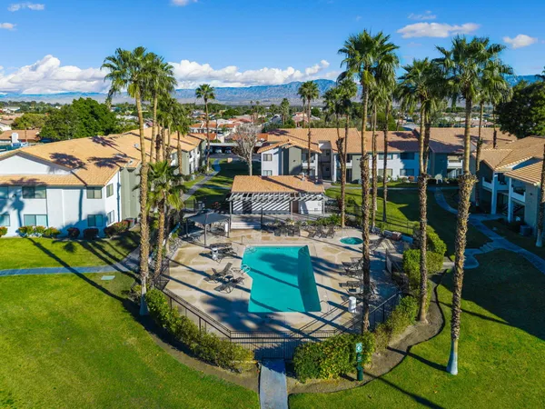 a childrens park with lots of trees and plants