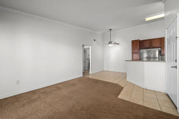 a view of a kitchen with wooden floor and staircase