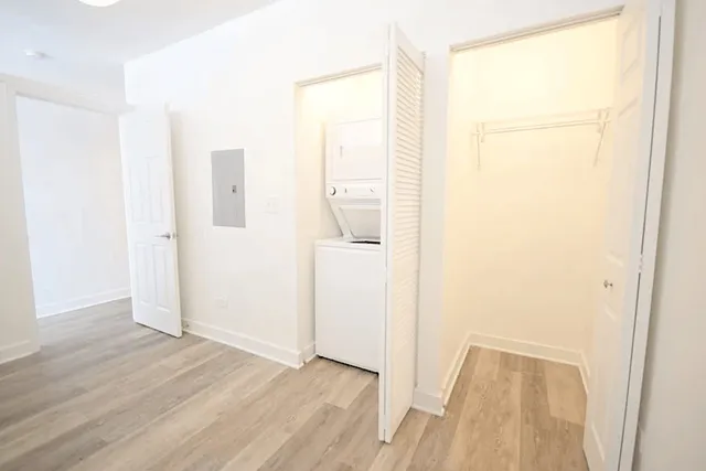 a view of hallway with wooden floor