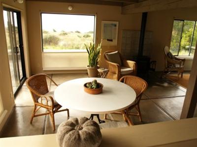 35366 Moonraker Road The Sea Ranch, CA 95497 - Photo 3 of 8 Kitchen and dining views to white water. The concrete floors gather heat as well as giving a contemporary look and feel.