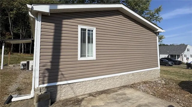 a view of a house with a yard and garage