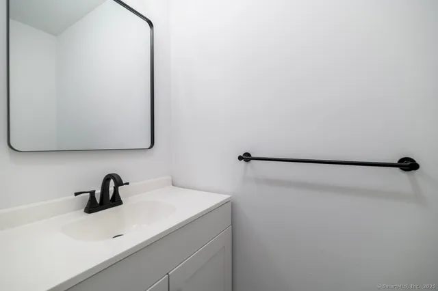 a close view of a sink and a vanity in the bathroom