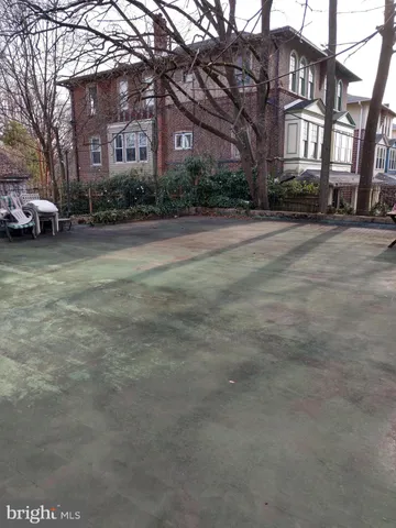 a view of a building with a yard