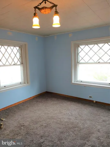 a kitchen with a refrigerator and cabinets