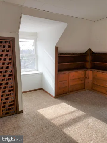 a view of kitchen with stove and refrigerator