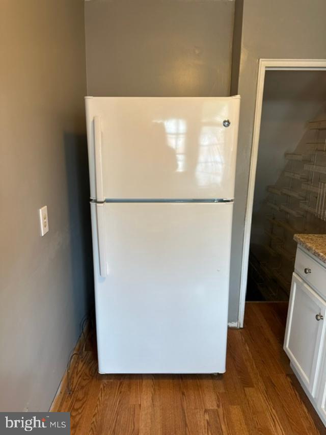 1619 Inverness Avenue Baltimore, MD 21230 - Photo 11 of 30 a white refrigerator freezer sitting in a kitchen