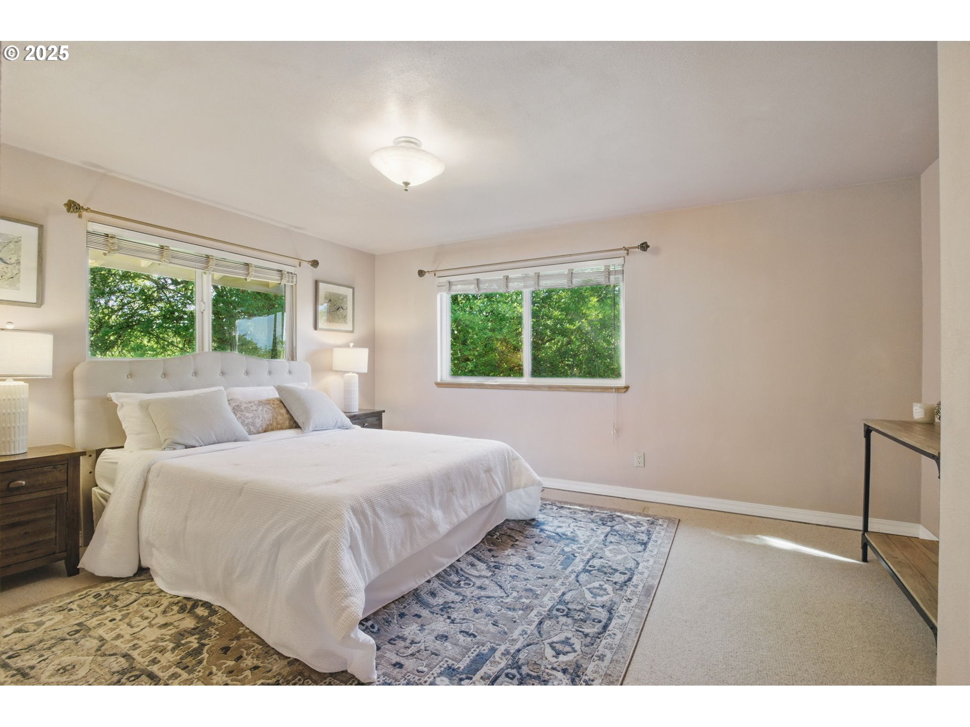 15960 Southwest Roshak Road Portland, OR 97224 - Photo 16 of 48 a bedroom with a large bed and a window
