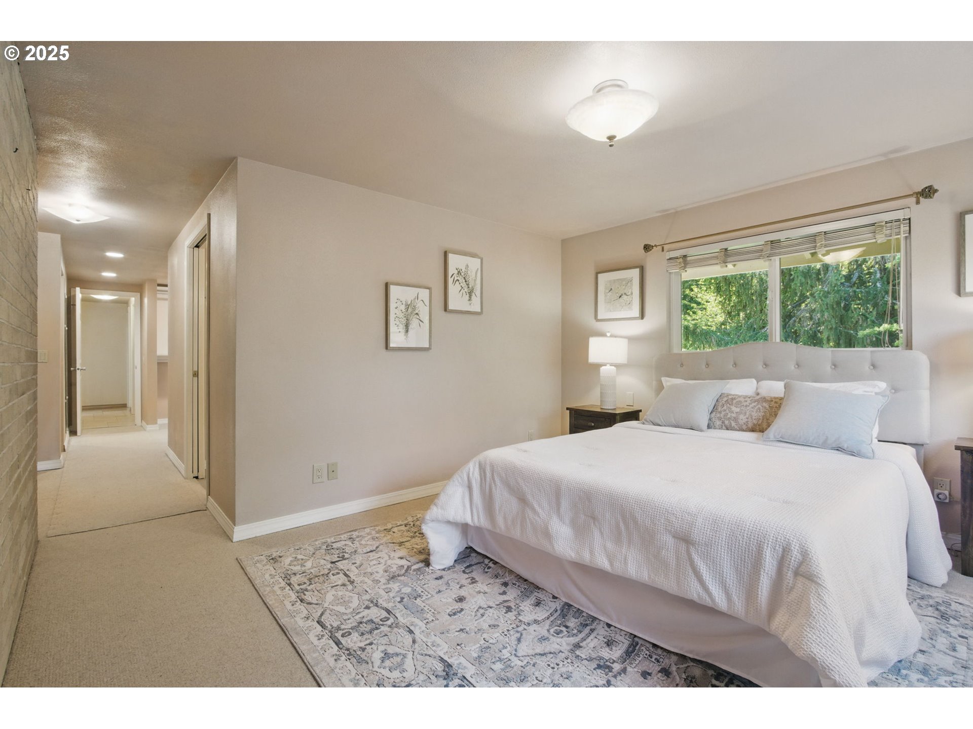 15960 Southwest Roshak Road Portland, OR 97224 - Photo 18 of 48 a bedroom with a bed and a lamp