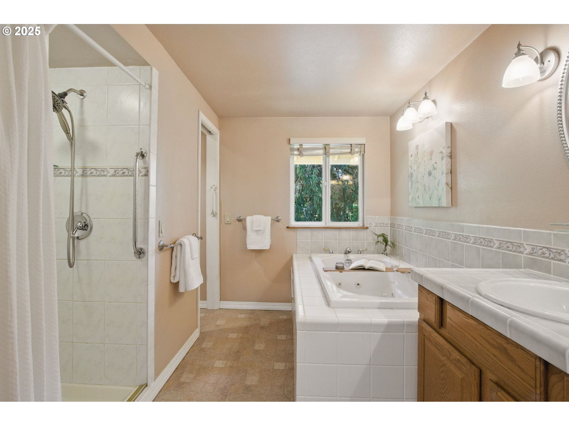 15960 Southwest Roshak Road Portland, OR 97224 - Photo 19 of 48 a bathroom with a sink mirror and a bathtub