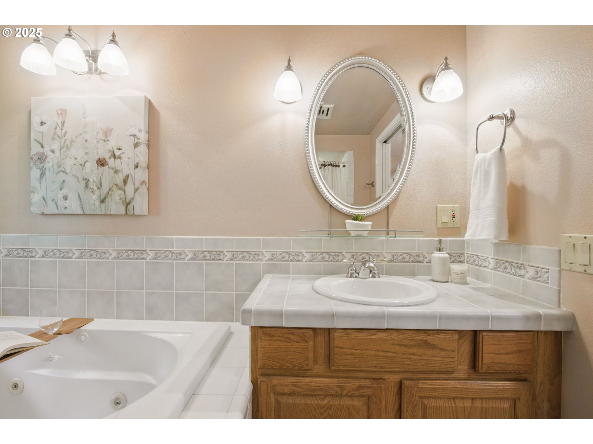 15960 Southwest Roshak Road Portland, OR 97224 - Photo 20 of 48 a bathroom with a sink and a mirror