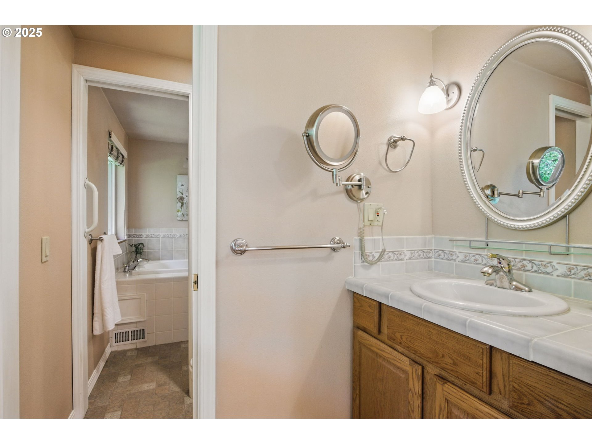 15960 Southwest Roshak Road Portland, OR 97224 - Photo 21 of 48 a bathroom with a sink and a mirror