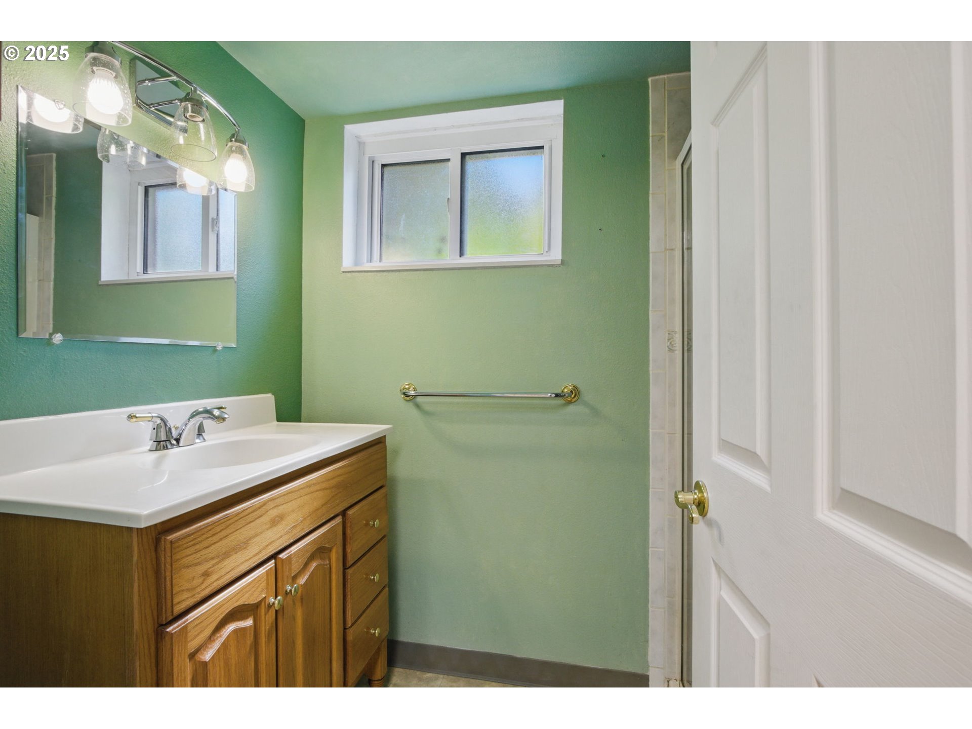 15960 Southwest Roshak Road Portland, OR 97224 - Photo 31 of 48 a bathroom with a sink and a mirror