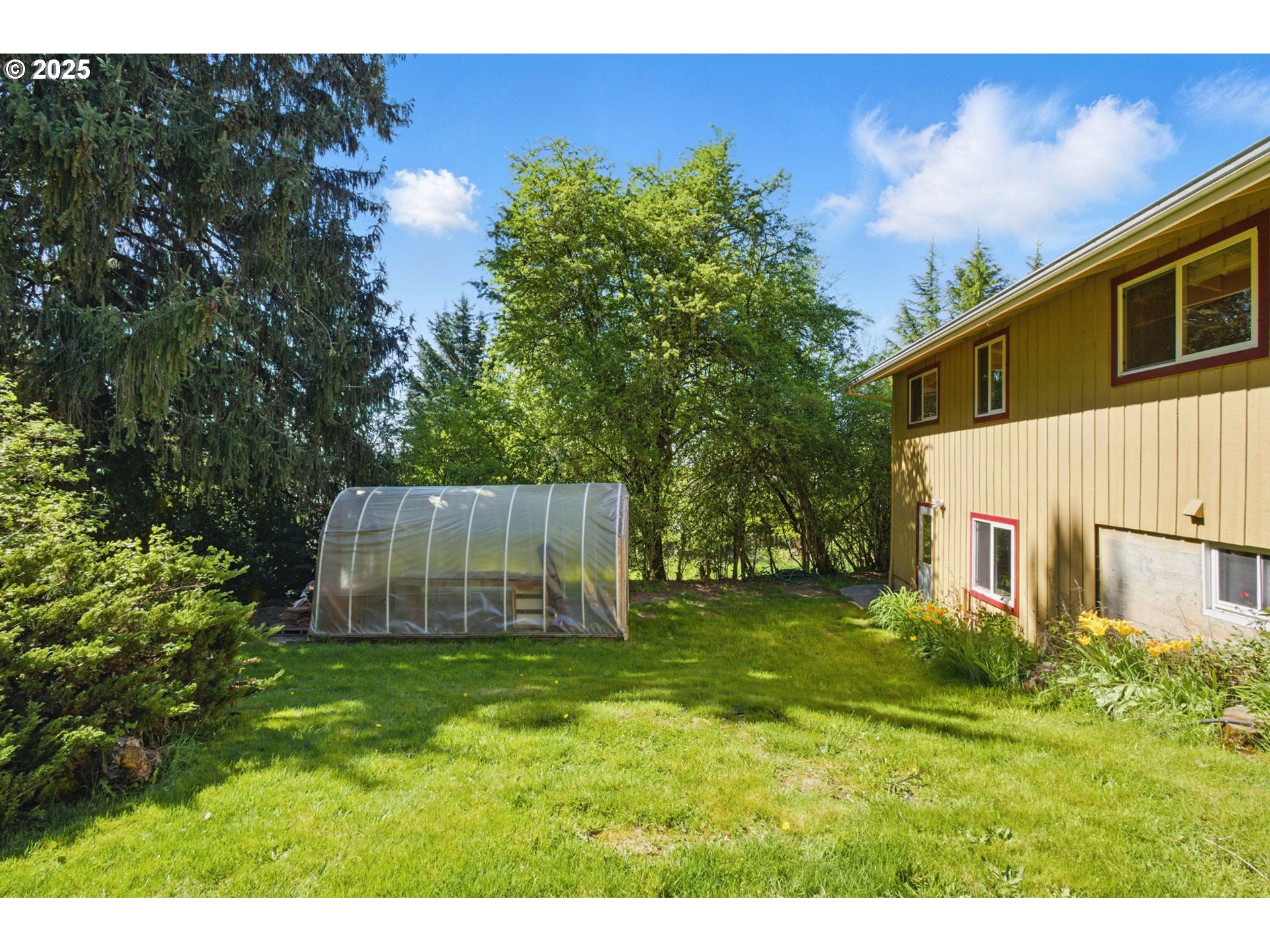 15960 Southwest Roshak Road Portland, OR 97224 - Photo 45 of 48 a view of a backyard with a house