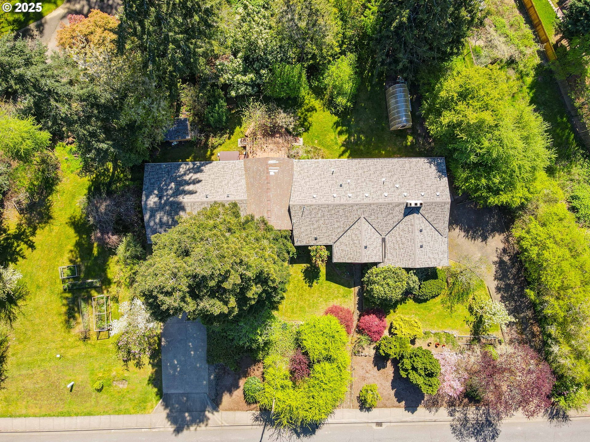 15960 Southwest Roshak Road Portland, OR 97224 - Photo 48 of 48 an aerial view of a house with a yard and garden