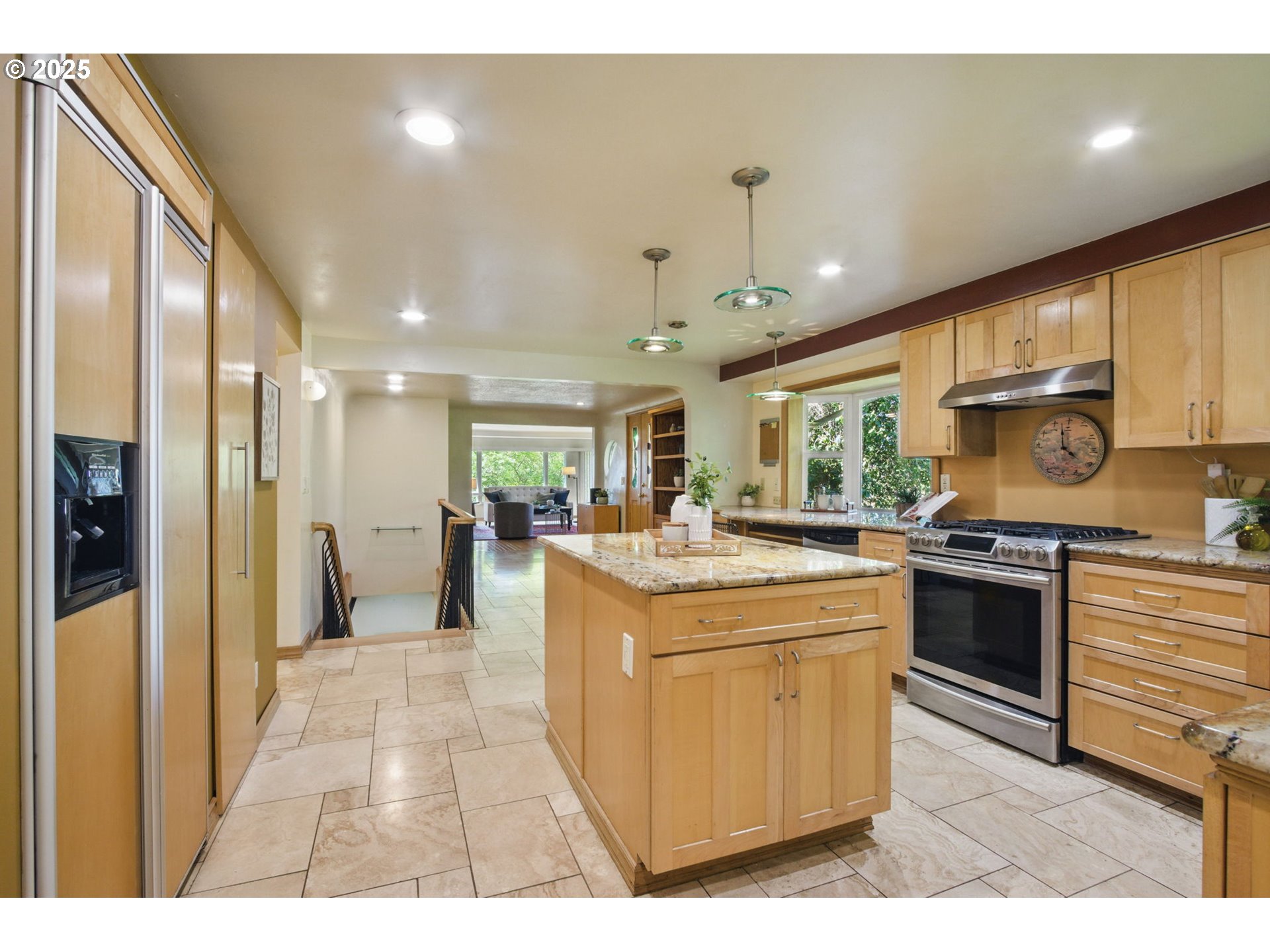 15960 Southwest Roshak Road Portland, OR 97224 - Photo 5 of 48 a kitchen with stainless steel appliances granite countertop a stove and a refrigerator