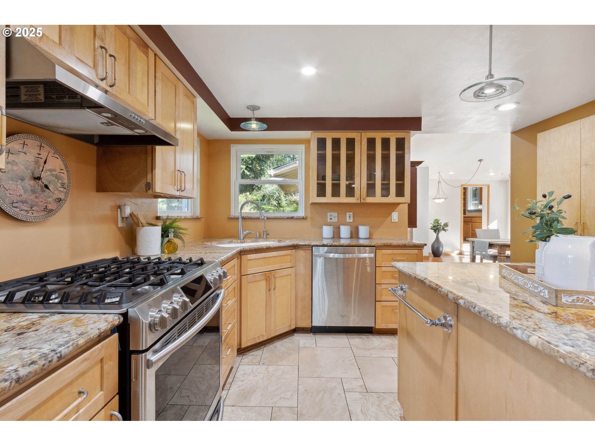 15960 Southwest Roshak Road Portland, OR 97224 - Photo 6 of 48 a kitchen with granite countertop a sink stove and cabinets