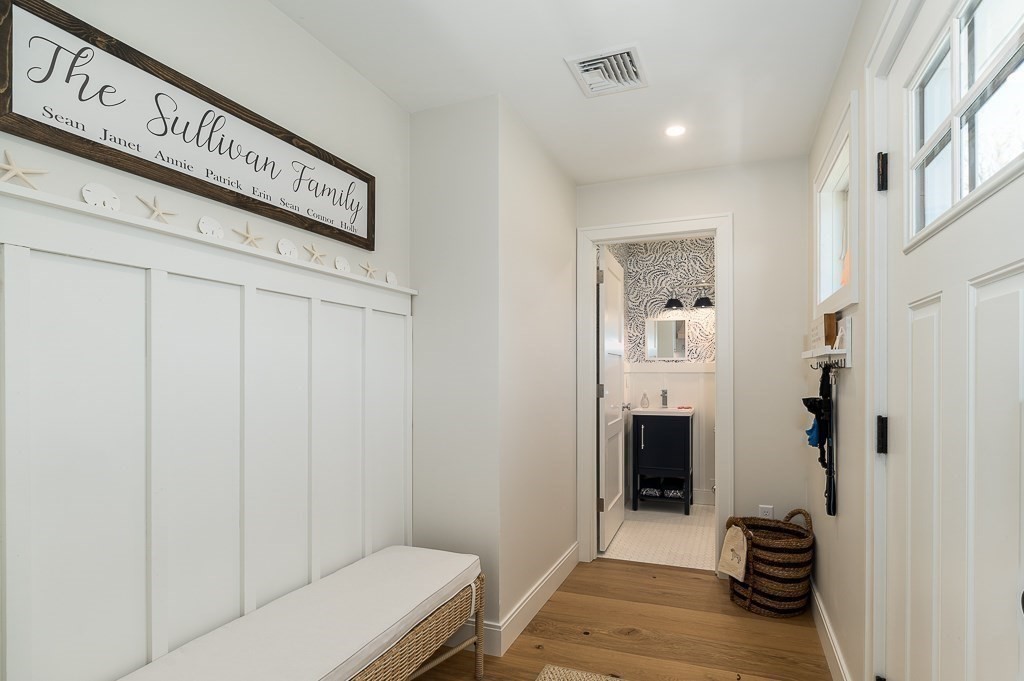 14 Sunset Point Road Gloucester, MA 01930 - Photo 15 of 40 a view of a hallway with closet and wooden floor