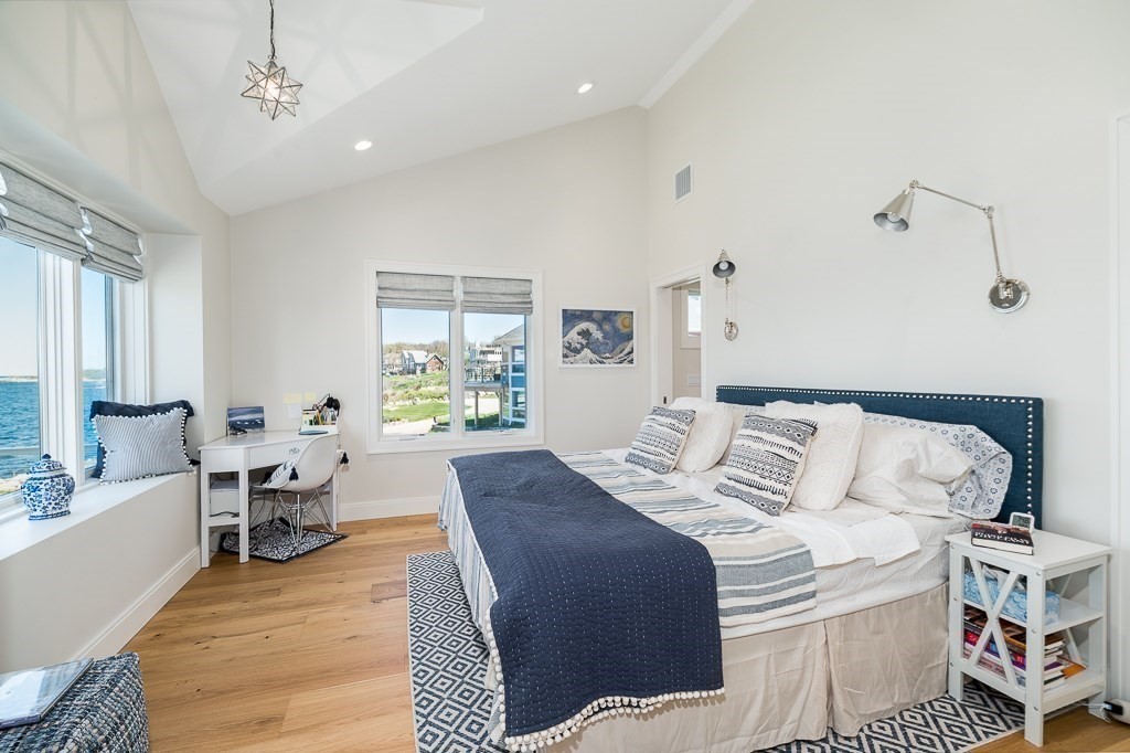 14 Sunset Point Road Gloucester, MA 01930 - Photo 17 of 40 a bedroom with a bed and wooden floor
