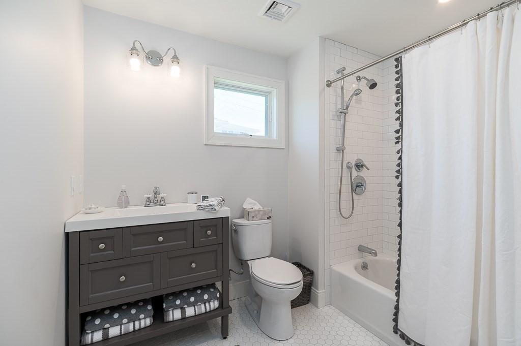 14 Sunset Point Road Gloucester, MA 01930 - Photo 20 of 40 a bathroom with a toilet a sink and a mirror