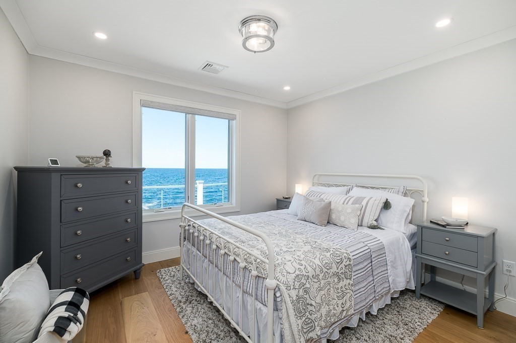 14 Sunset Point Road Gloucester, MA 01930 - Photo 22 of 40 a bedroom with a bed and a window