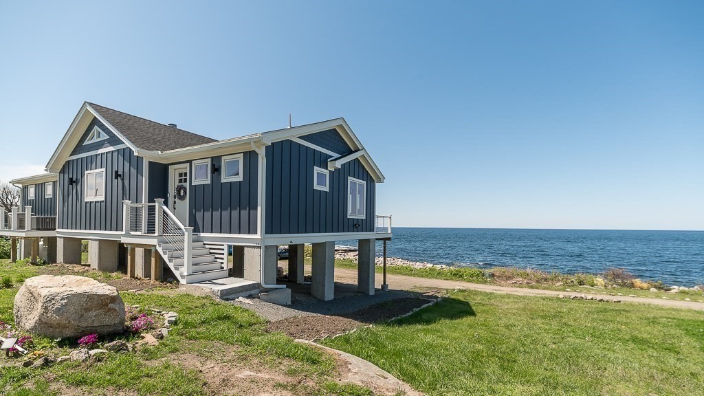 14 Sunset Point Road Gloucester, MA 01930 - Photo 36 of 40 a front view of a house with a yard balcony