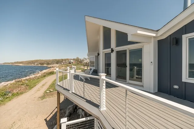 a view of a balcony with ocean view