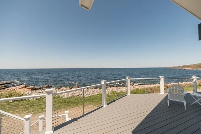 a view of a balcony with an ocean