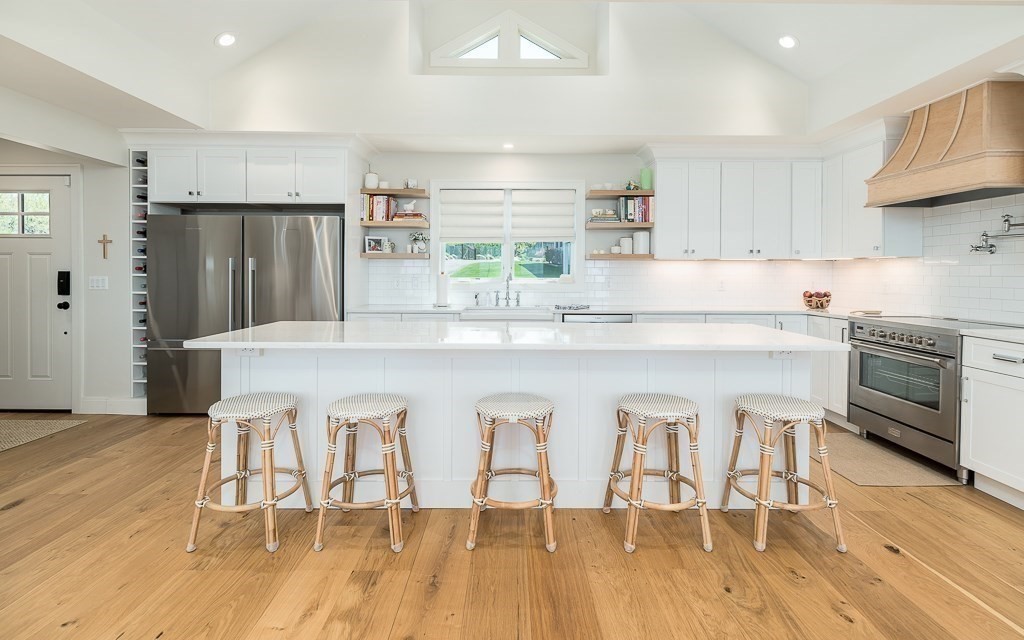 14 Sunset Point Road Gloucester, MA 01930 - Photo 9 of 40 a kitchen with stainless steel appliances granite countertop a kitchen island hardwood floor and a sink