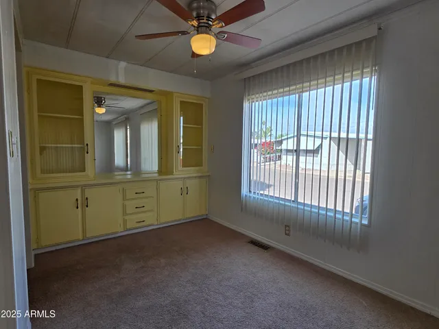 a spacious bathroom with a double vanity sink a mirror and a bathtub