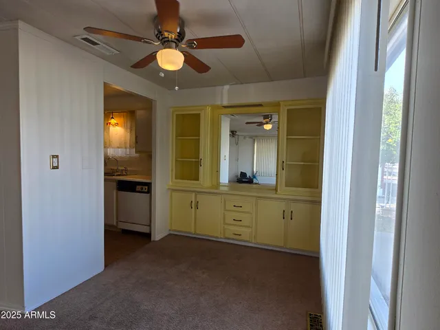 a kitchen with a sink and a refrigerator