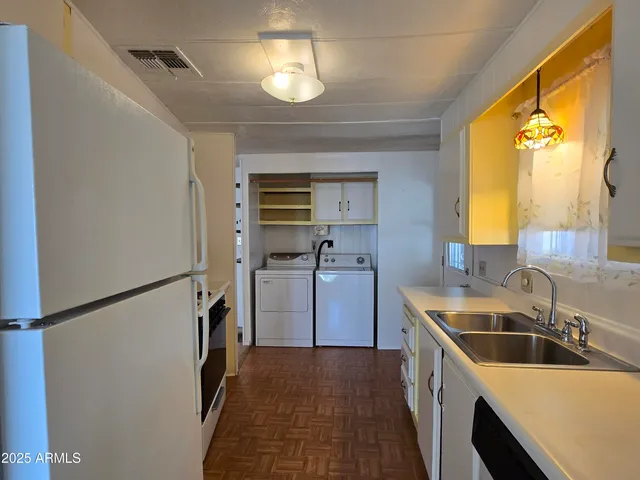 a kitchen with stainless steel appliances granite countertop a stove and a refrigerator