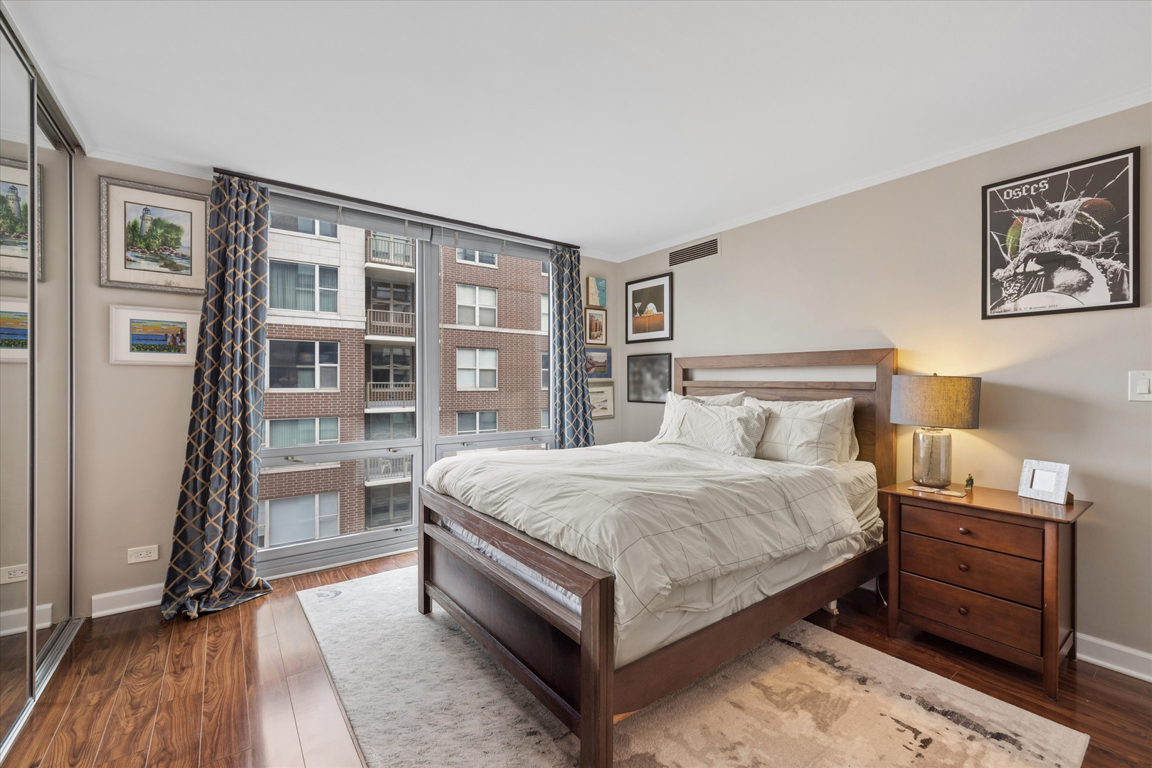 21 West Goethe Street, Unit 15A Chicago, IL 60610 - Photo 11 of 20 a bedroom with a bed and a cabinets